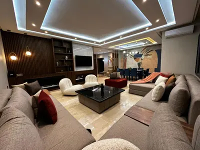 a large living room with couches and a television at 3 Rooms & View in Casablanca