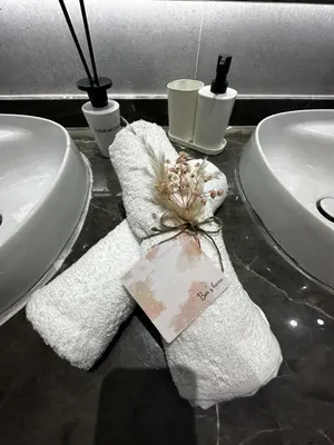 a towel on a counter next to two sinks at 3 Rooms & View in Casablanca