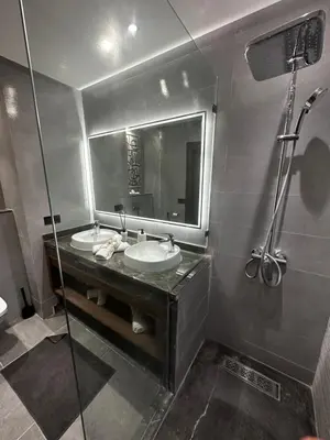 a bathroom with a sink and a mirror and a shower at 3 Rooms & View in Casablanca