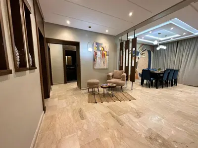 a dining room and living room with a table and chairs at 3 Rooms & View in Casablanca