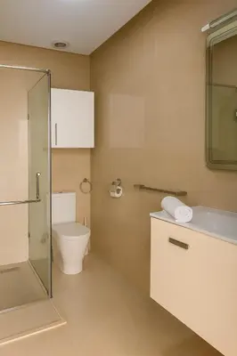 a bathroom with a toilet and a glass shower at Casablanca in panoramic mode in Casablanca
