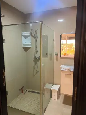 a bathroom with a shower with a glass enclosure at Casablanca in panoramic mode in Casablanca