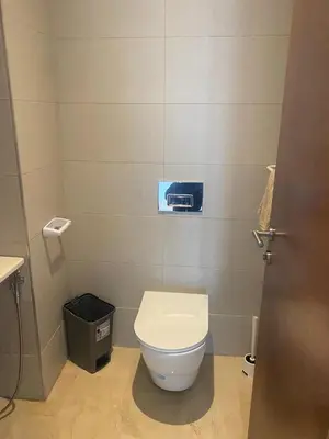 a bathroom with a toilet and a trash can at Charmant appartement à Anfa in Casablanca