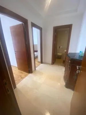 a room with a bathroom with a toilet and a mirror at Charmant appartement à Anfa in Casablanca