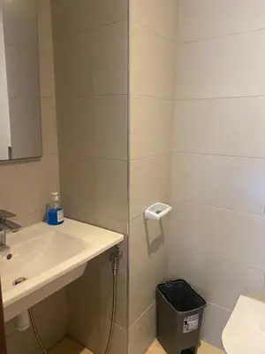 a bathroom with a sink and a mirror at Charmant appartement à Anfa in Casablanca