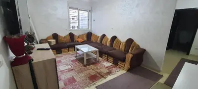 a living room with couches and a table at Appartement situated 10 min from city center in Settat