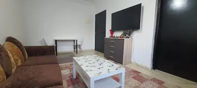 a living room with a couch and a tv at Appartement situated 10 min from city center in Settat