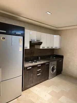 a kitchen with a refrigerator and a washing machine at Flora Nora - Central Tramway - by Mi-haven in Casablanca