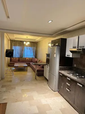 a kitchen and living room with a couch at Flora Nora - Central Tramway - by Mi-haven in Casablanca