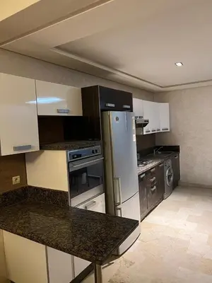 a kitchen with a refrigerator and a counter top at Flora Nora - Central Tramway - by Mi-haven in Casablanca