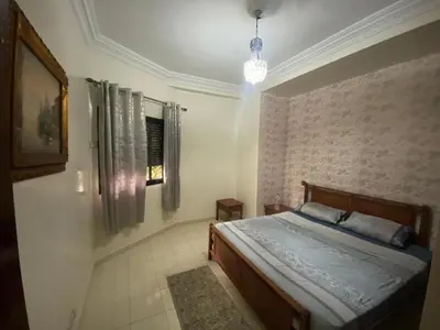 a bedroom with a bed and a wall at casablanca,bourgogne,corniche in Casablanca
