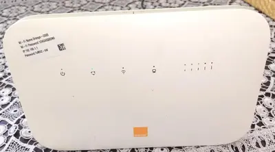 a white router sitting on top of a table at Aeroport Tissir Appartement in Nouaceur