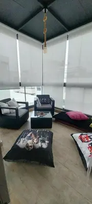 a living room with couches and pillows on the floor at Residence paradise beach el Mansoria in Mohammedia