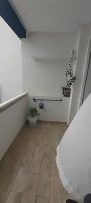 a room with a bed and potted plants in it at Residence paradise beach el Mansoria in Mohammedia