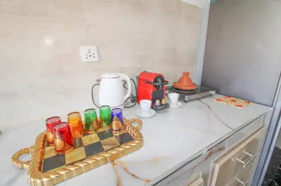 a tray of drinking glasses sitting on a kitchen counter at Studio Panoramique, Mosquée Hassan II, Cœur de la Médina in Casablanca
