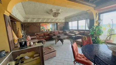 a living room with a couch and a table at Zaouia in Rabat