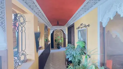 a hallway of a house with a red ceiling at Zaouia in Rabat