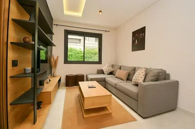 a living room with a couch and a coffee table at Atelier Aedes - Studio 1 in Maarif
