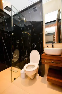 a bathroom with a toilet and a sink and a shower at Atelier Aedes - Studio 1 in Maarif