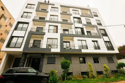 a building with a car parked in front of it at Atelier Aedes - Studio 1 in Maarif