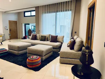 a living room with two couches and a couch at Villa Bahia Golf beach - Bouznika in Casablanca