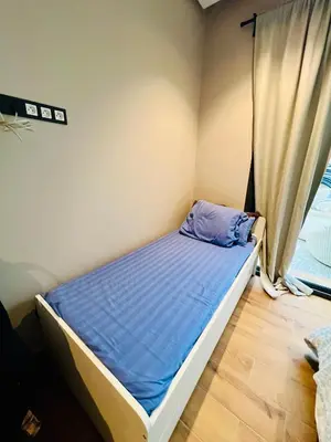 a small bed in a room with a window at Villa Bahia Golf beach - Bouznika in Casablanca