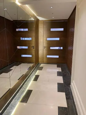 a hallway with glass doors and a walk in shower at 1 bed with balcony near CFC in Casablanca