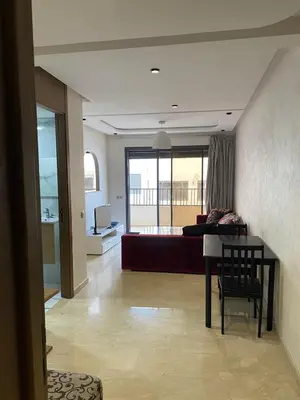 a living room with a couch and a table at 1 bed with balcony near CFC in Casablanca