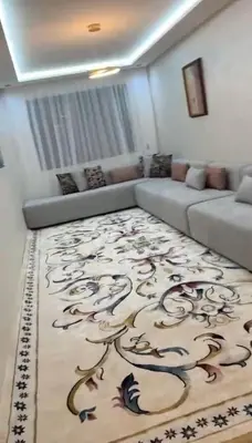 a living room with a couch and a rug at McDonalds Apartment 2 Mars in Casablanca