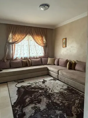 a living room with a couch and a window at McDonalds Apartment 2 Mars in Casablanca
