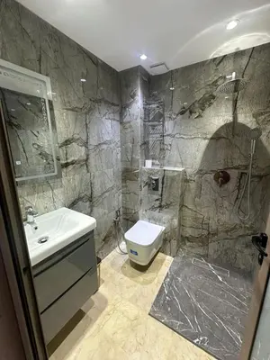 a bathroom with a sink and a shower and a toilet at McDonalds Apartment 2 Mars in Casablanca