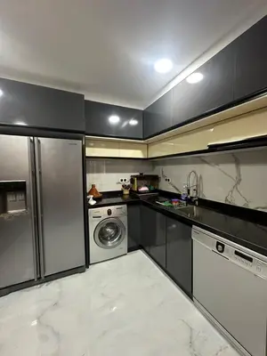 a kitchen with stainless steel appliances and a dishwasher at McDonalds Apartment 2 Mars in Casablanca