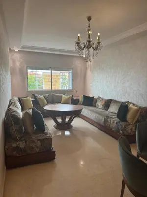 a living room with a couch and a table at Appartement Sara in Mohammedia