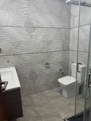 a bathroom with a toilet and a sink at Appartement Sara in Mohammedia