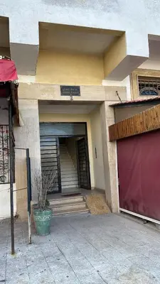 an entrance to a building with a garage at Housse moderne Versailles in Rabat
