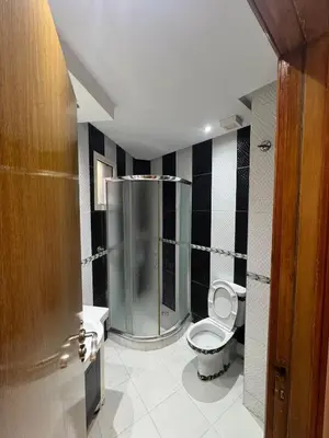 a bathroom with a shower and a toilet in it at Housse moderne Versailles in Rabat