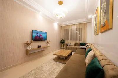 a living room with a couch and a table at Appartement Cosy Casablanca in Casablanca