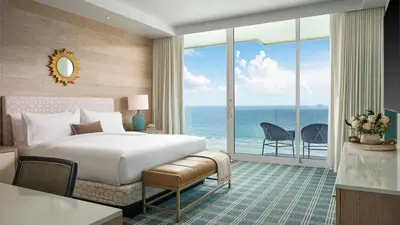 a bedroom with a bed and a view of the ocean at fresh in Casablanca