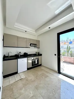 a kitchen with a sink and a stove at Maarif Picasso Studio & Private Terrace & Parking in Casablanca