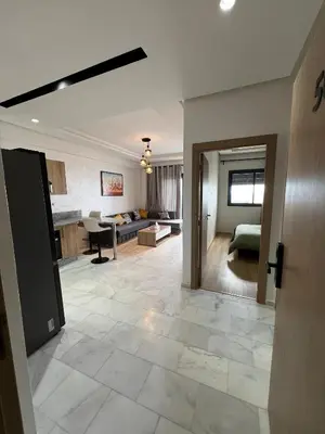 a room with a living room and a kitchen at Ocean park zenata in Aïn Harrouda