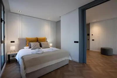 a bedroom with a large bed with yellow pillows at Central Cozy & Great Location with 2 Balconies Fast Wifi 2 Minutes to KFC Mcdo Bd 2 Mars in Casablanca