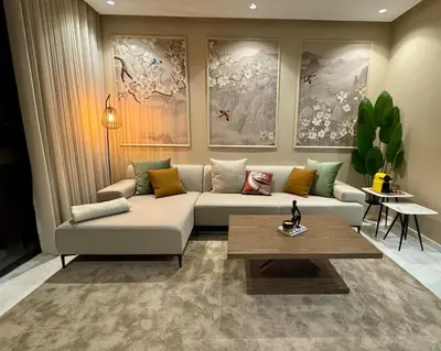 a living room with a couch and a coffee table at Central Luxurious & Great Location Ultra Fast Wi-Fi In The Heart Of Casablanca Oasis Disrict With A City View in Casablanca