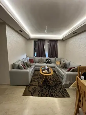 a living room with a couch and a table at Zahira New Luxury Near The Beach - Entire Apartment in Casablanca