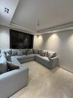 a living room with couches and a flat screen tv at Zahira New Luxury Near The Beach - Entire Apartment in Casablanca