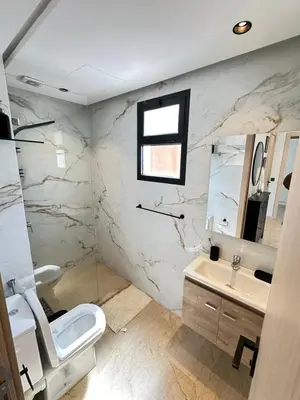 a bathroom with a toilet and a sink at chic escape in Casablanca