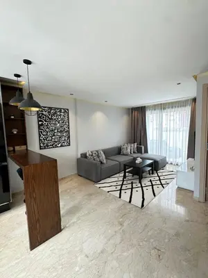 a living room with a couch and a table at chic escape in Casablanca