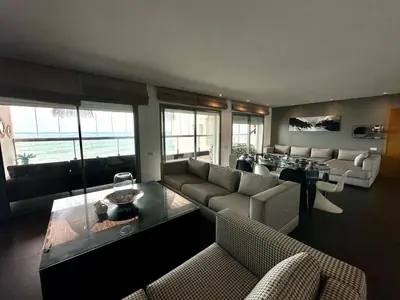 a living room with a couch and a table at 360 Sea View - Marina - Spacious 3 BR Retreat in Casablanca