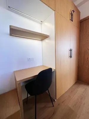 a room with a wooden desk and a chair at Stylish loft with view and terrace Maarif Gauthier in Casablanca