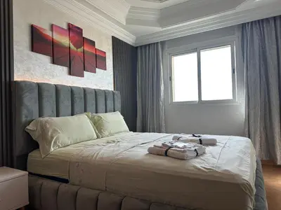 a bedroom with a bed with two towels on it at Signorina appartamento in Temara