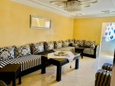 a living room with a couch and a table at familly house in Tamaris